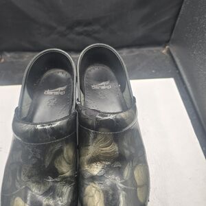 Dansko Black and Gold Floral Clogs